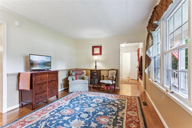 105 Stavenger Ct, Williamsburg, VA 23188 - living area featuring healthy amount of natural light, wood finished floors, and baseboards