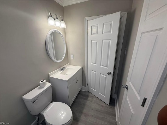 461 Dare Ave, Hampton, VA 23661 - bathroom with vanity, crown molding, toilet, wood finished floors, and baseboards