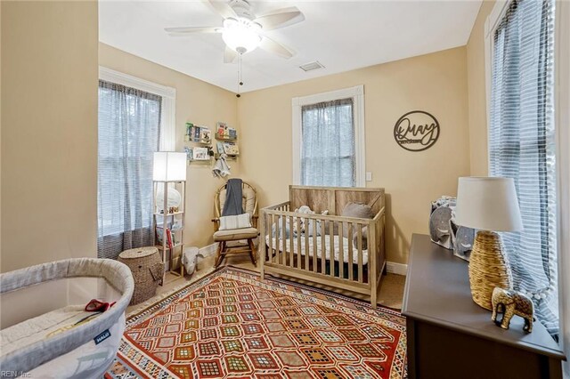 3317 Montana Ave, Norfolk, VA 23513 - bedroom featuring baseboards, a nursery area, and a ceiling fan