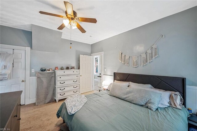 3317 Montana Ave, Norfolk, VA 23513 - bedroom with light carpet, a wainscoted wall, and a ceiling fan