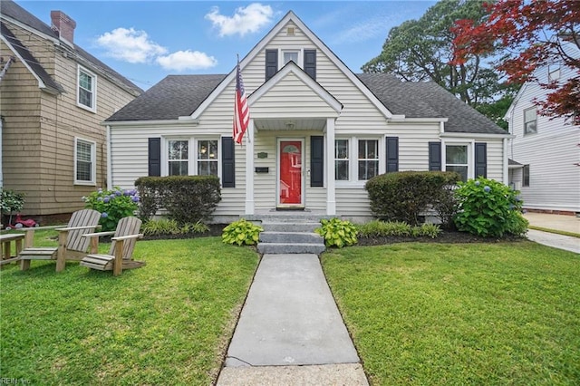 6223 Rolfe Ave, Norfolk, VA 23508 - bungalow-style house with a shingled roof and a front yard