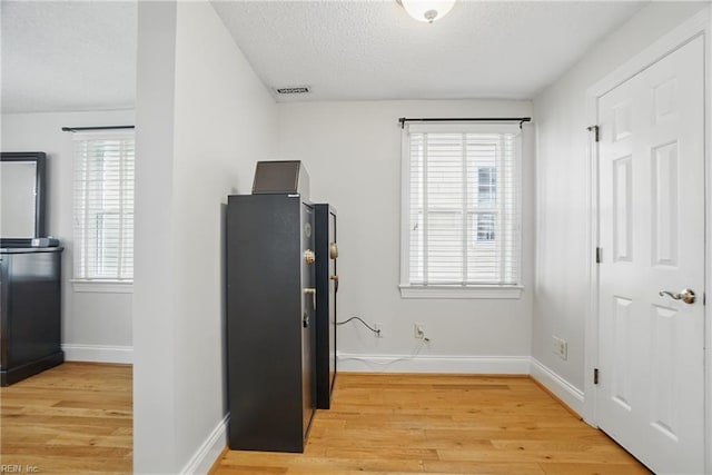 6223 Rolfe Ave, Norfolk, VA 23508 - interior space featuring a textured ceiling, light wood-style flooring, and baseboards