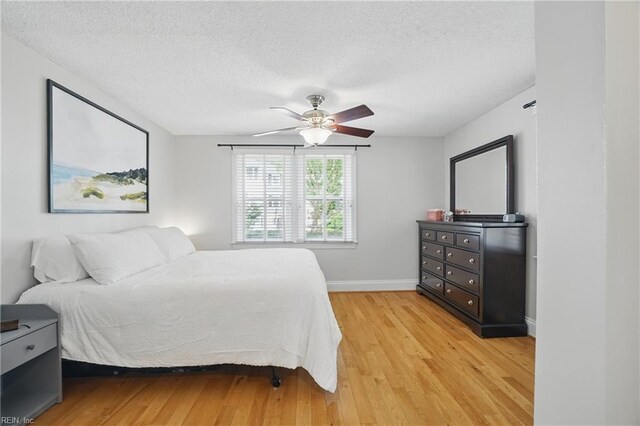 6223 Rolfe Ave, Norfolk, VA 23508 - bedroom with a textured ceiling, light wood finished floors, baseboards, and ceiling fan