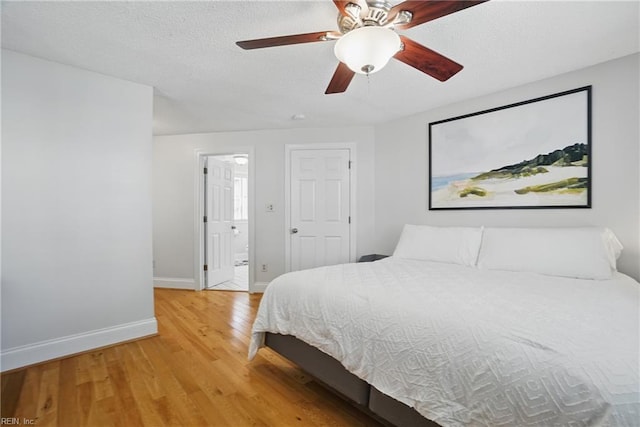 6223 Rolfe Ave, Norfolk, VA 23508 - bedroom featuring baseboards, light wood-style floors, ensuite bathroom, and a ceiling fan