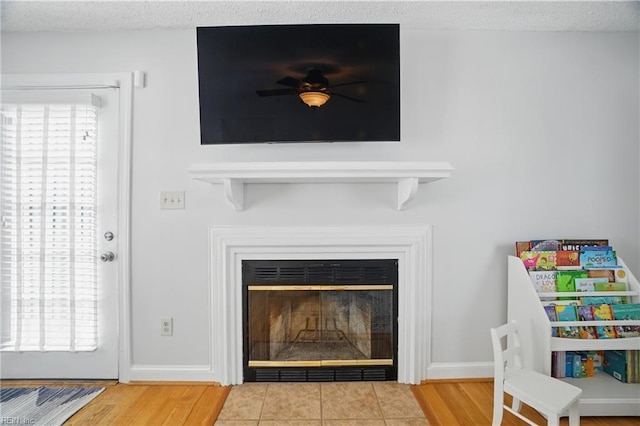 6223 Rolfe Ave, Norfolk, VA 23508 - detailed view of a fireplace with flush hearth, wood finished floors, and ceiling fan