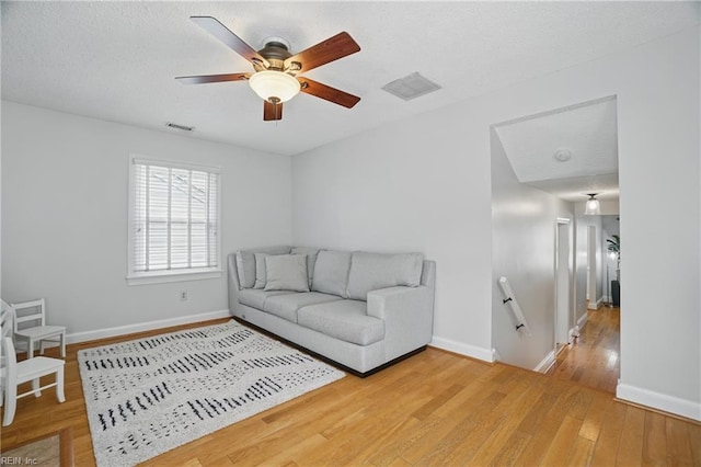6223 Rolfe Ave, Norfolk, VA 23508 - living area with light wood-style floors, baseboards, and a ceiling fan