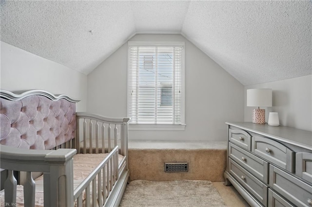 6223 Rolfe Ave, Norfolk, VA 23508 - bedroom featuring light carpet, a textured ceiling, and vaulted ceiling