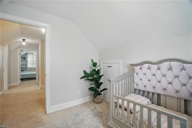 6223 Rolfe Ave, Norfolk, VA 23508 - carpeted bedroom with vaulted ceiling, a textured ceiling, and baseboards