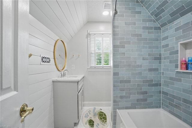 6223 Rolfe Ave, Norfolk, VA 23508 - full bath with lofted ceiling, vanity, baseboards, shower / bath combination, and tile patterned flooring