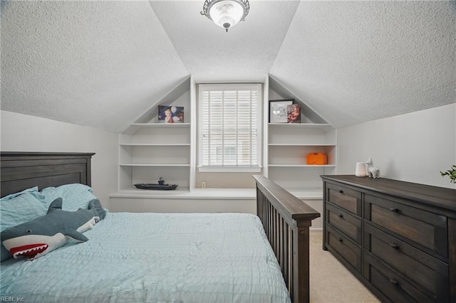 6223 Rolfe Ave, Norfolk, VA 23508 - bedroom featuring a textured ceiling, vaulted ceiling, and light colored carpet