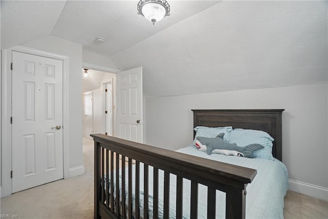 6223 Rolfe Ave, Norfolk, VA 23508 - bedroom with lofted ceiling, light carpet, a textured ceiling, and baseboards