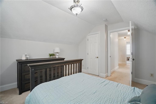 6223 Rolfe Ave, Norfolk, VA 23508 - bedroom featuring lofted ceiling, light colored carpet, a textured ceiling, and baseboards