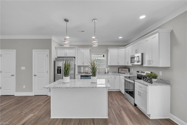 308 N Division St Unit A, Suffolk, VA 23434 - kitchen featuring appliances with stainless steel finishes, crown molding, white cabinetry, pendant lighting, and recessed lighting