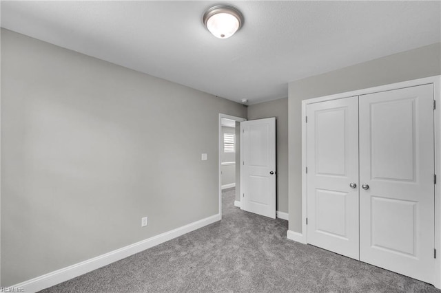 308 N Division St Unit A, Suffolk, VA 23434 - unfurnished bedroom featuring carpet flooring, baseboards, and a closet
