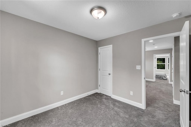 308 N Division St Unit A, Suffolk, VA 23434 - unfurnished bedroom featuring dark colored carpet and baseboards