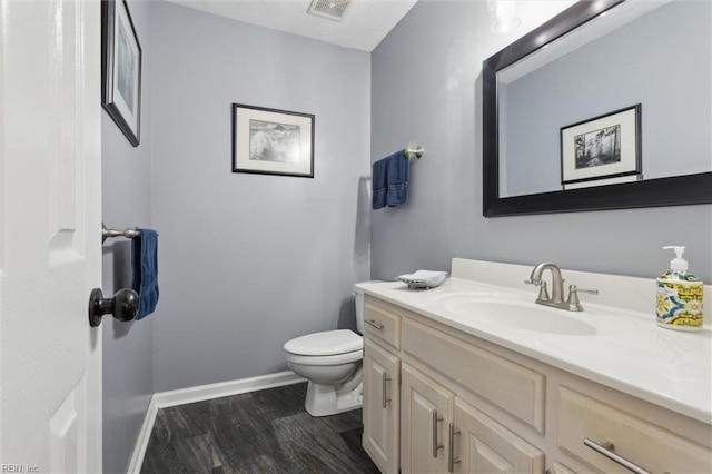 108 Silver Fox Trce, Yorktown, VA 23693 - half bath featuring toilet, vanity, wood finished floors, and baseboards