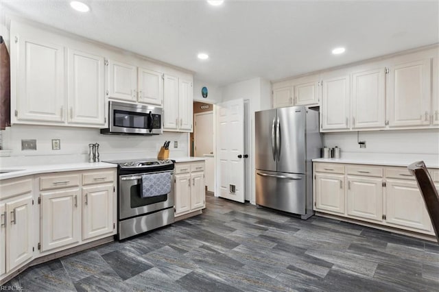 108 Silver Fox Trce, Yorktown, VA 23693 - kitchen with stainless steel appliances, light countertops, recessed lighting, and white cabinetry