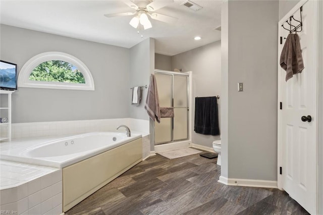 108 Silver Fox Trce, Yorktown, VA 23693 - bathroom with toilet, a garden tub, a stall shower, ceiling fan, and baseboards