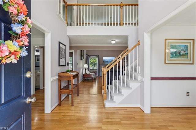 108 Silver Fox Trce, Yorktown, VA 23693 - foyer with stairs, wood finished floors, a high ceiling, baseboards, and ornamental molding
