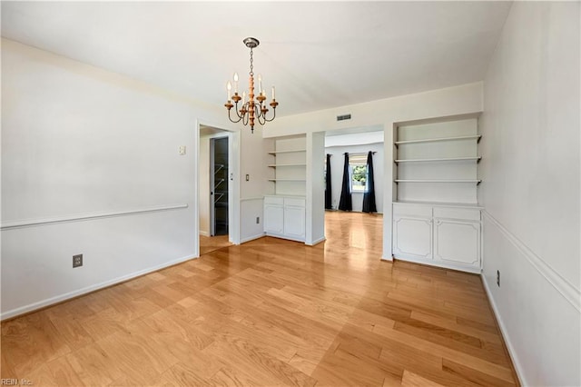 4456 Hudgins Dr, Virginia Beach, VA 23455 - unfurnished dining area with a chandelier, baseboards, and light wood-style flooring