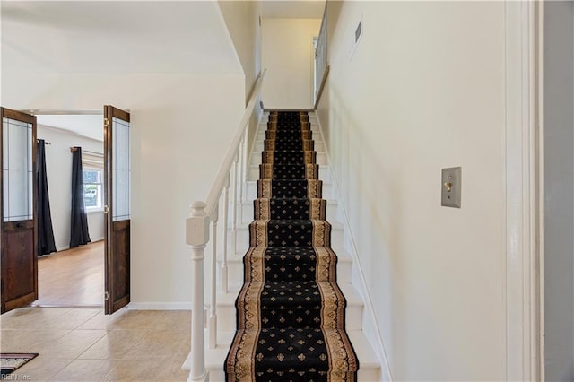 4456 Hudgins Dr, Virginia Beach, VA 23455 - staircase featuring tile patterned floors and baseboards
