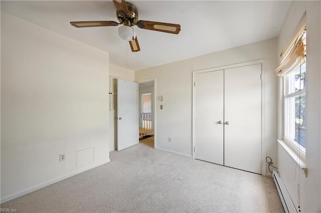 4456 Hudgins Dr, Virginia Beach, VA 23455 - unfurnished bedroom with carpet flooring, baseboard heating, a ceiling fan, baseboards, and a closet