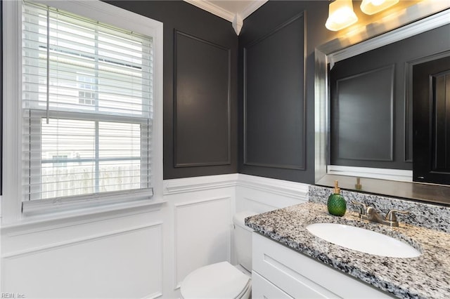82 Beacon Rd, Portsmouth, VA 23702 - bathroom featuring a decorative wall, vanity, ornamental molding, healthy amount of natural light, and toilet