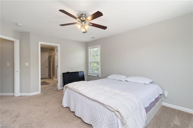 82 Beacon Rd, Portsmouth, VA 23702 - bedroom featuring light colored carpet, baseboards, and ceiling fan