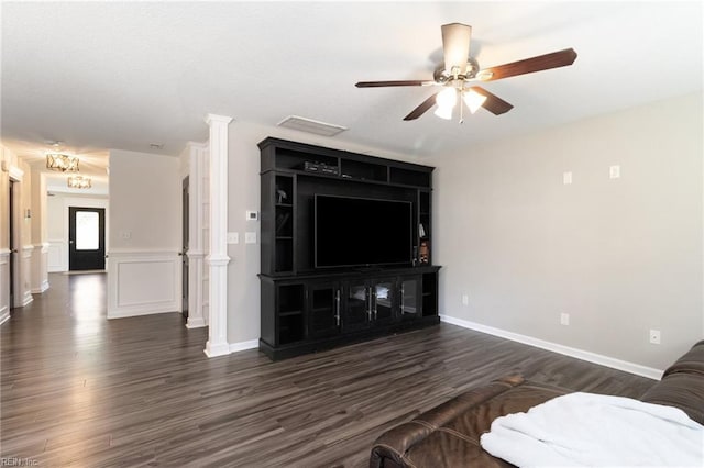82 Beacon Rd, Portsmouth, VA 23702 - living area with ceiling fan, dark wood-style flooring, ornate columns, and baseboards