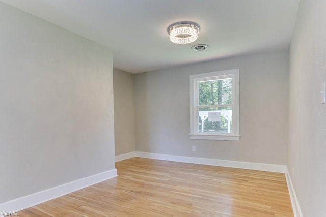 5833 Hedgerow Ln, Portsmouth, VA 23703 - empty room with light wood-style floors and baseboards