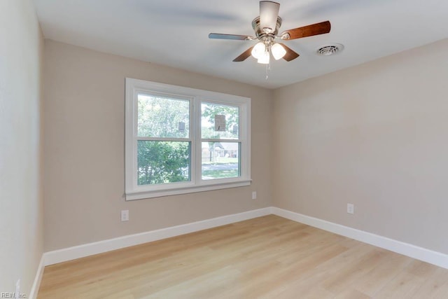 5833 Hedgerow Ln, Portsmouth, VA 23703 - empty room with light wood finished floors and baseboards