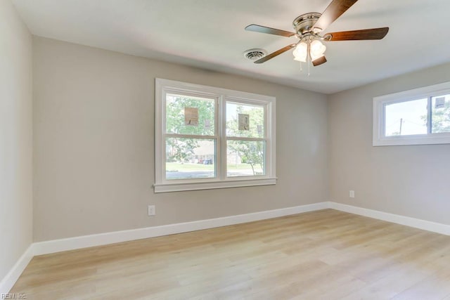 5833 Hedgerow Ln, Portsmouth, VA 23703 - unfurnished room featuring light wood-type flooring, a ceiling fan, and baseboards