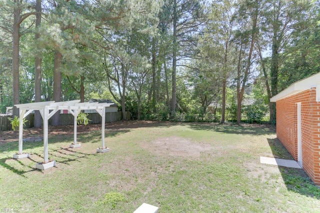 5833 Hedgerow Ln, Portsmouth, VA 23703 - view of yard featuring a pergola and view of scattered trees