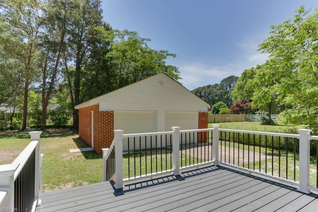 5833 Hedgerow Ln, Portsmouth, VA 23703 - wooden deck featuring a garage, an outdoor structure, and a yard