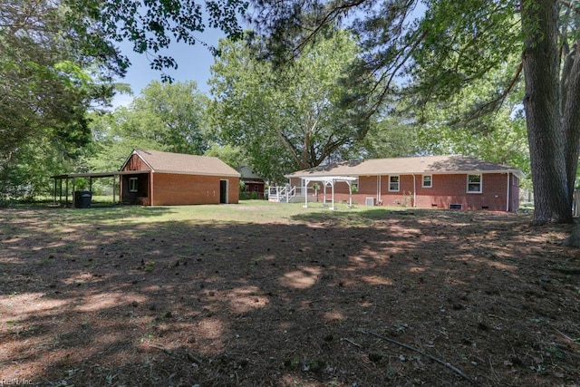 5833 Hedgerow Ln, Portsmouth, VA 23703 - view of yard with a carport and view of wooded area