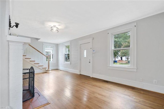 309 Linden Ave, Suffolk, VA 23434 - entryway featuring stairs, wood finished floors, healthy amount of natural light, and crown molding