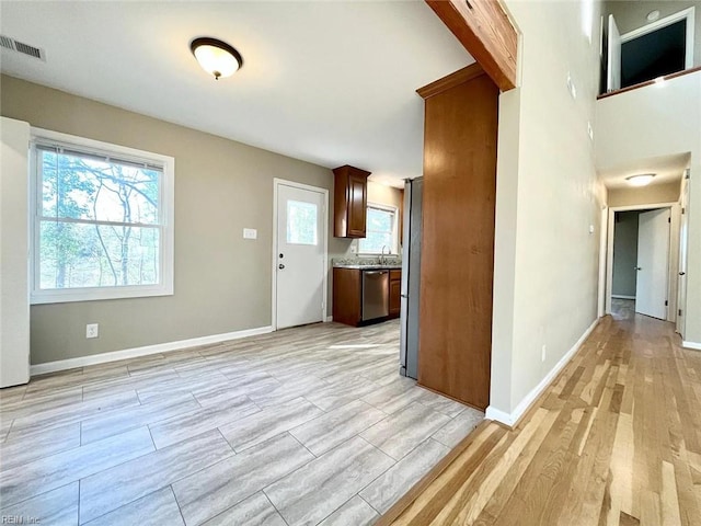 10104 Ogilvy Ln, Carrollton, VA 23314 - kitchen with dishwasher, healthy amount of natural light, and light wood-style floors