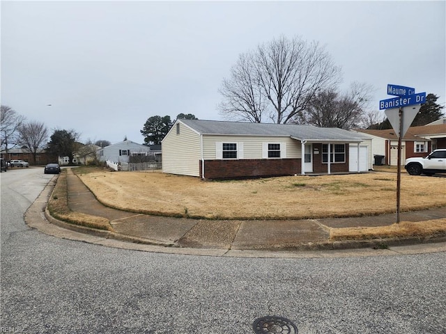 1 Maume Cir, Hampton, VA 23666 - view of front facade featuring brick siding and a front yard