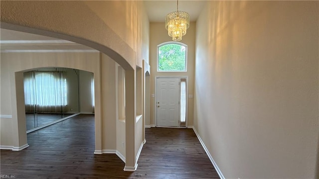 2019 River Pearl Way, Chesapeake, VA 23321 - entrance foyer with arched walkways, dark wood-style floors, a chandelier, baseboards, and a high ceiling