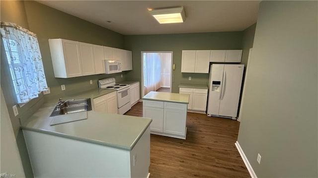 2019 River Pearl Way, Chesapeake, VA 23321 - kitchen with white appliances, a sink, dark wood finished floors, white cabinets, and light countertops