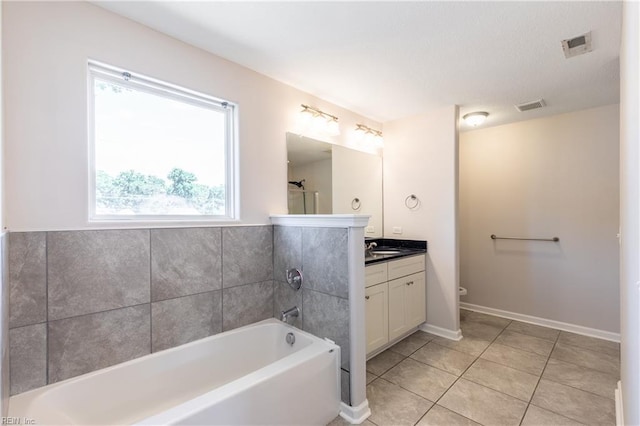 429 Draper Dr, Norfolk, VA 23505 - full bathroom featuring a garden tub, vanity, toilet, and tile patterned floors