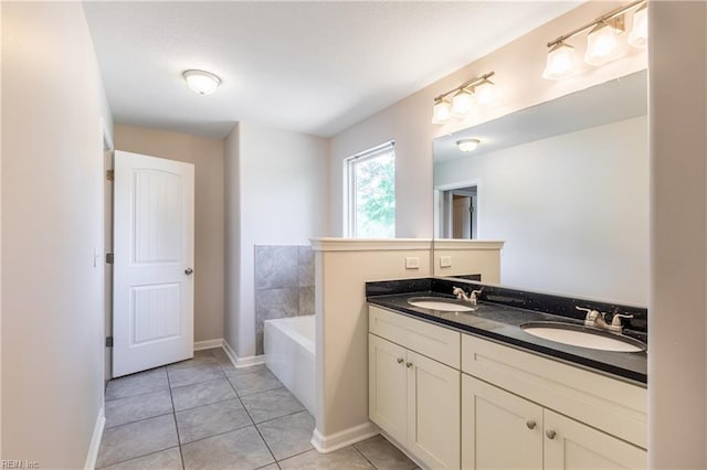 429 Draper Dr, Norfolk, VA 23505 - bathroom with double vanity, tile patterned flooring, a bath, and baseboards