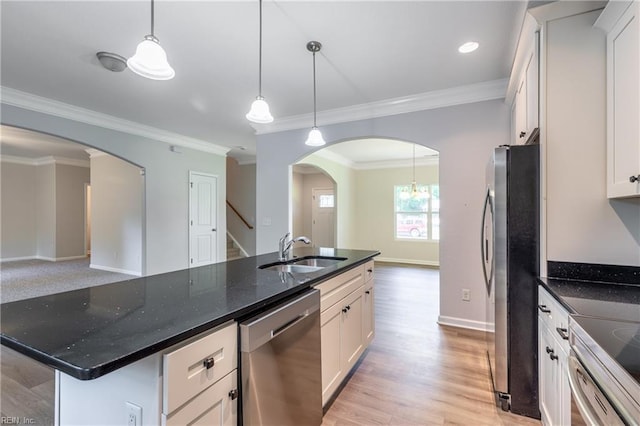 429 Draper Dr, Norfolk, VA 23505 - kitchen featuring stainless steel appliances, arched walkways, a sink, ornamental molding, and white cabinets