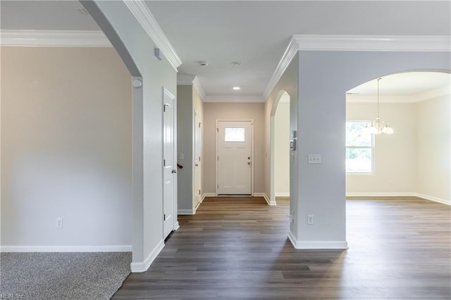 429 Draper Dr, Norfolk, VA 23505 - foyer entrance featuring dark wood finished floors, arched walkways, a chandelier, baseboards, and ornamental molding