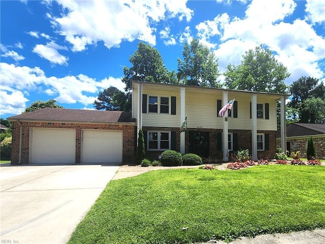 5097 Rochelle Rd, Virginia Beach, VA 23464 - view of front of house featuring brick siding, a front lawn, an attached garage, and concrete driveway