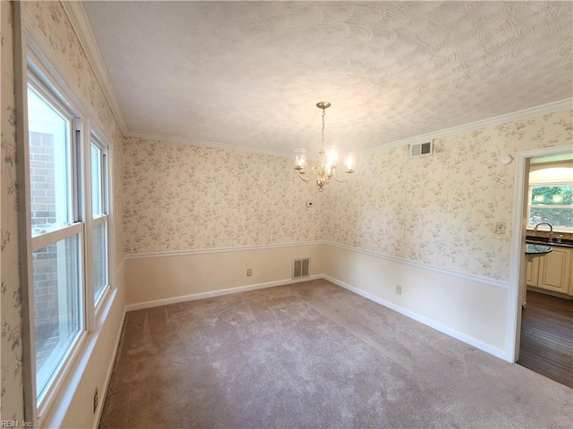 5097 Rochelle Rd, Virginia Beach, VA 23464 - unfurnished dining area with a chandelier, carpet flooring, wallpapered walls, ornamental molding, and a sink