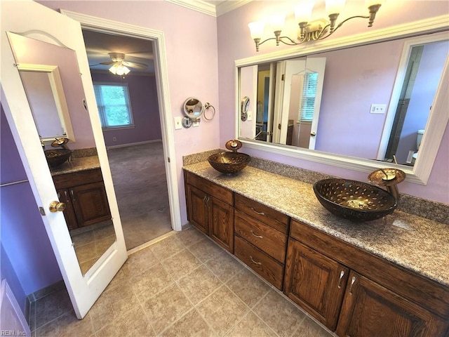 5097 Rochelle Rd, Virginia Beach, VA 23464 - bathroom featuring ornamental molding, vanity, a ceiling fan, and baseboards