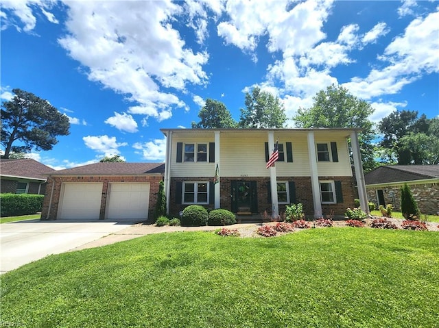 5097 Rochelle Rd, Virginia Beach, VA 23464 - view of front of home with brick siding, a garage, a front yard, and driveway