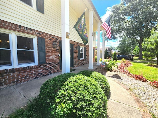 5097 Rochelle Rd, Virginia Beach, VA 23464 - view of exterior entry with covered porch and brick siding