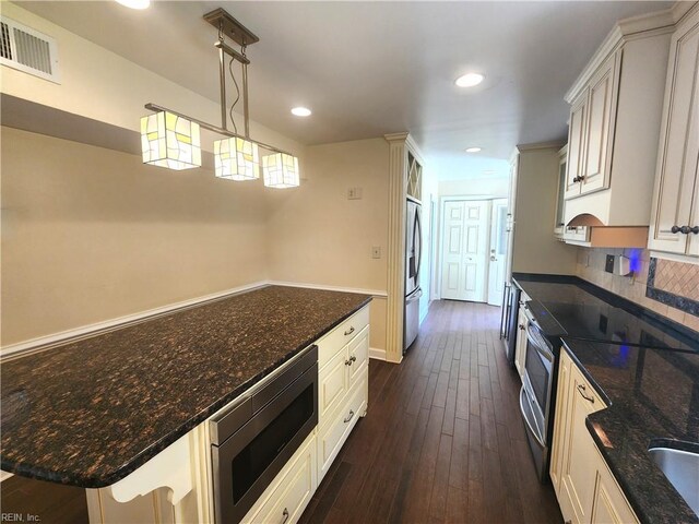5097 Rochelle Rd, Virginia Beach, VA 23464 - kitchen featuring stainless steel appliances, dark wood-type flooring, recessed lighting, dark stone countertops, and decorative light fixtures